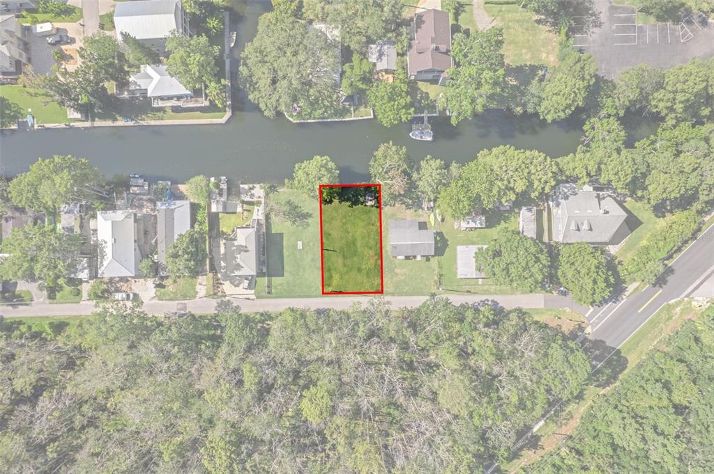 5492 Ramada Street Weeki Wachee, FL 34607 - Photo 4 of 25 a front view of a house with a yard