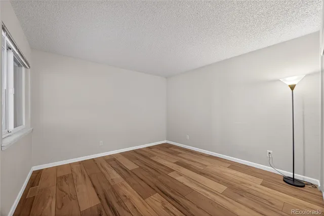 a view of room with wooden floor