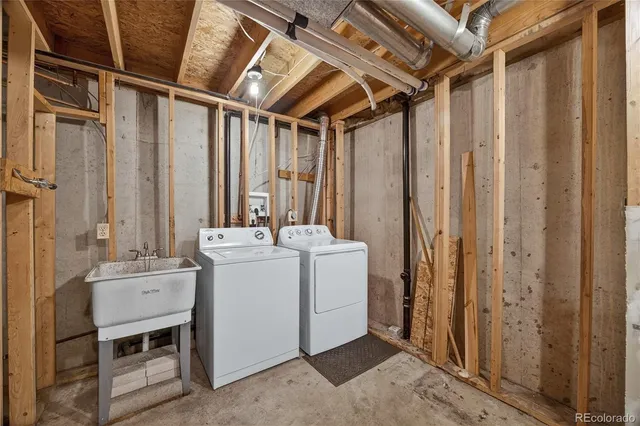 a view of bathroom with a sink and mirror