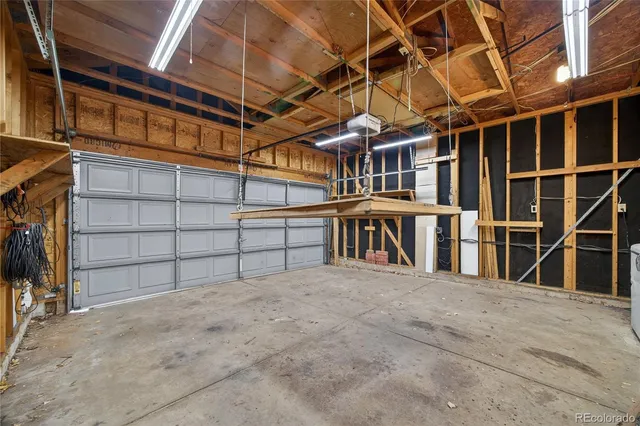 a view of empty room with wooden ceiling