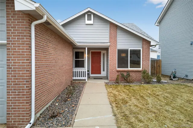 a front view of a house with a garage