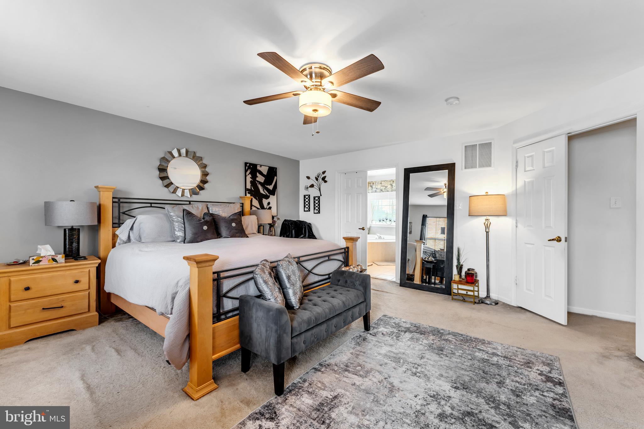 5660 Compton Lane Eldersburg, MD 21784 - Photo 22 of 44 a bedroom with a bed and ceiling fan