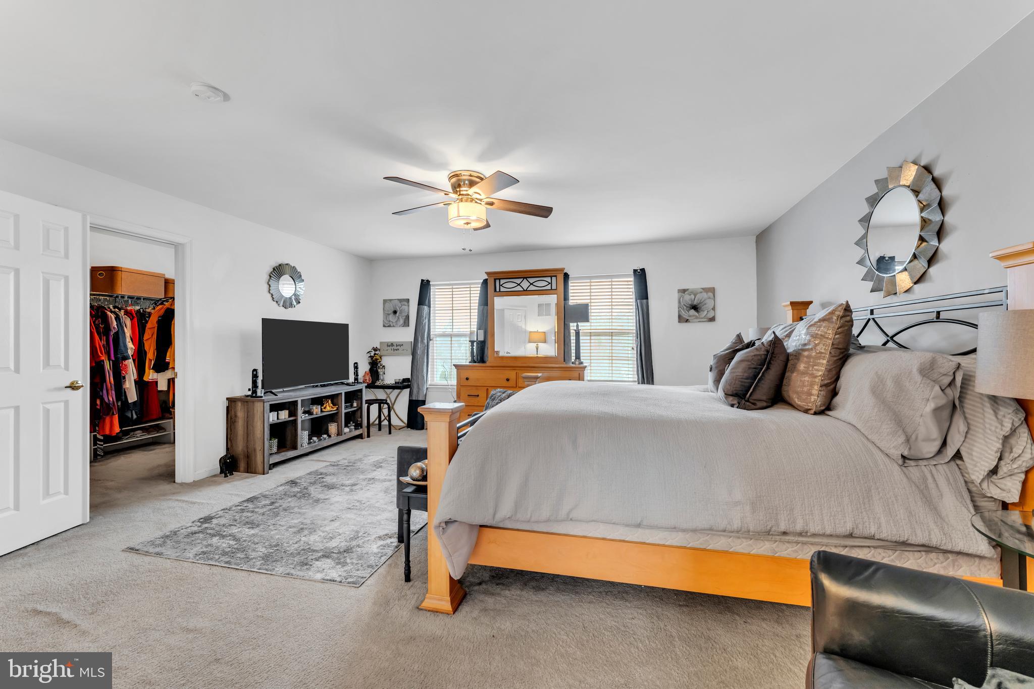 5660 Compton Lane Eldersburg, MD 21784 - Photo 23 of 44 a bedroom with a bed and a flat screen tv