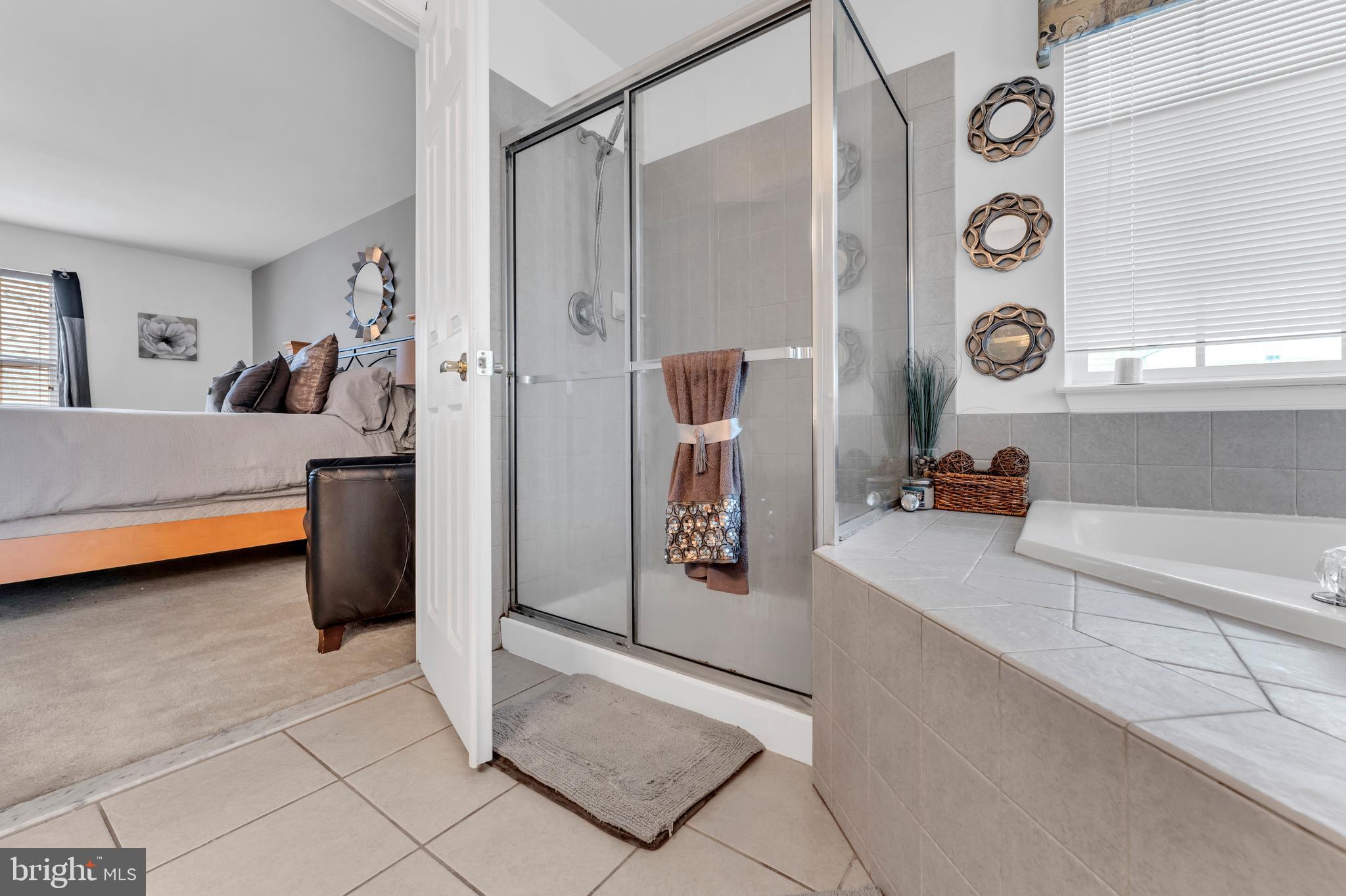 5660 Compton Lane Eldersburg, MD 21784 - Photo 29 of 44 a view of walk in closet with clothes and shoes
