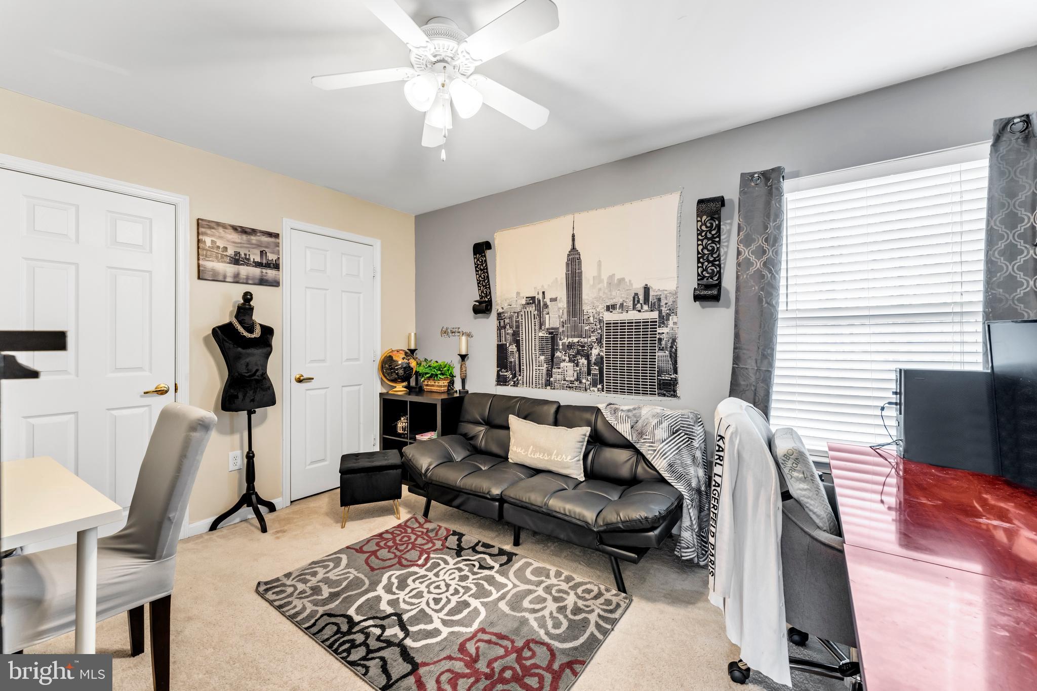 5660 Compton Lane Eldersburg, MD 21784 - Photo 33 of 44 a living room with furniture and a rug