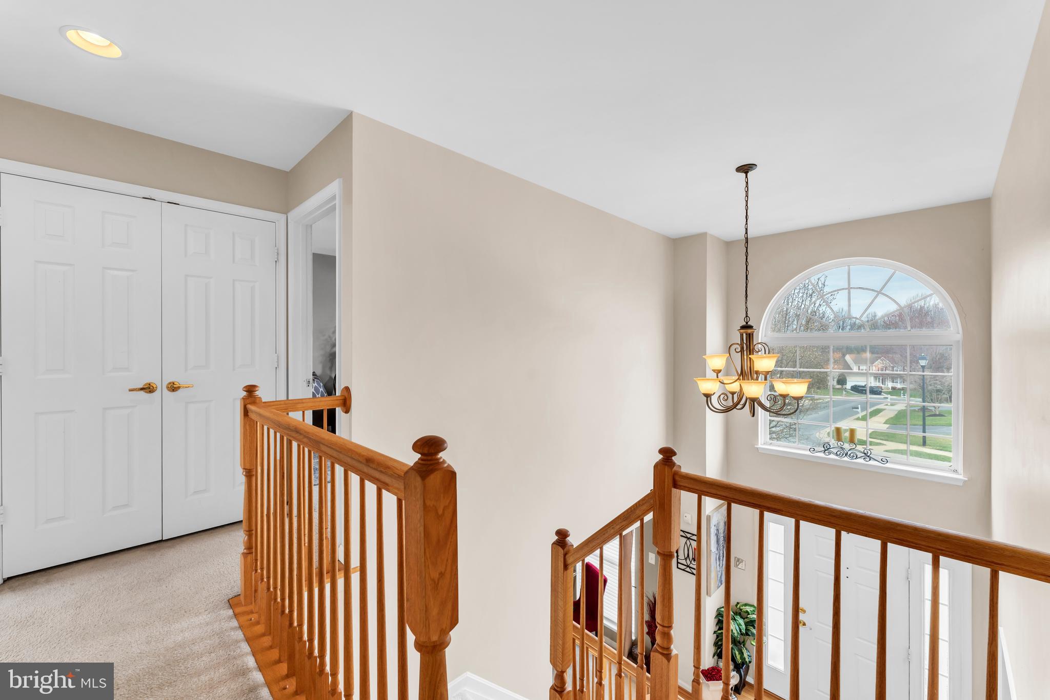 5660 Compton Lane Eldersburg, MD 21784 - Photo 35 of 44 a view of hallway with wooden floor and windows