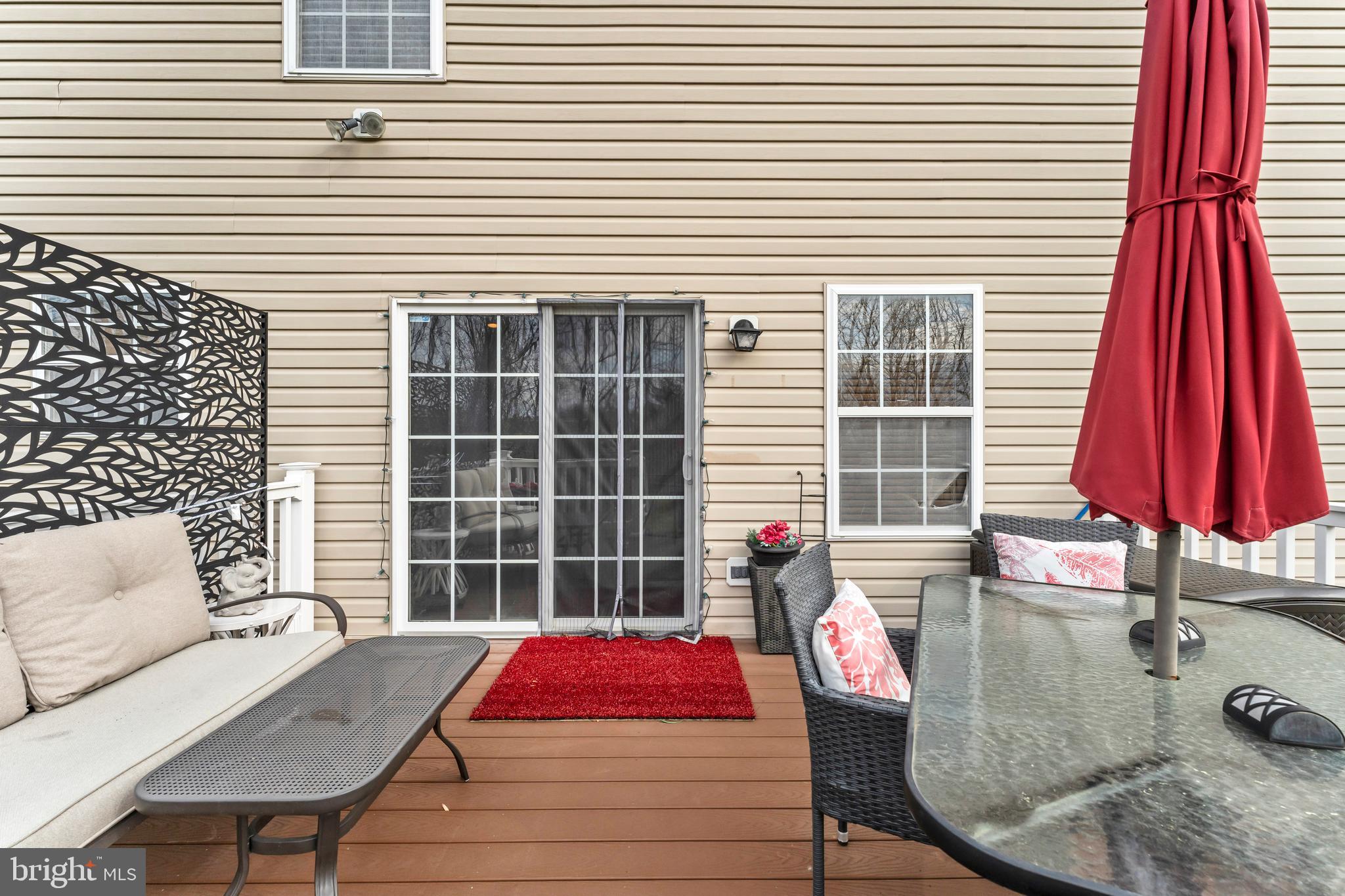 5660 Compton Lane Eldersburg, MD 21784 - Photo 37 of 44 a view of a chairs and table in the balcony