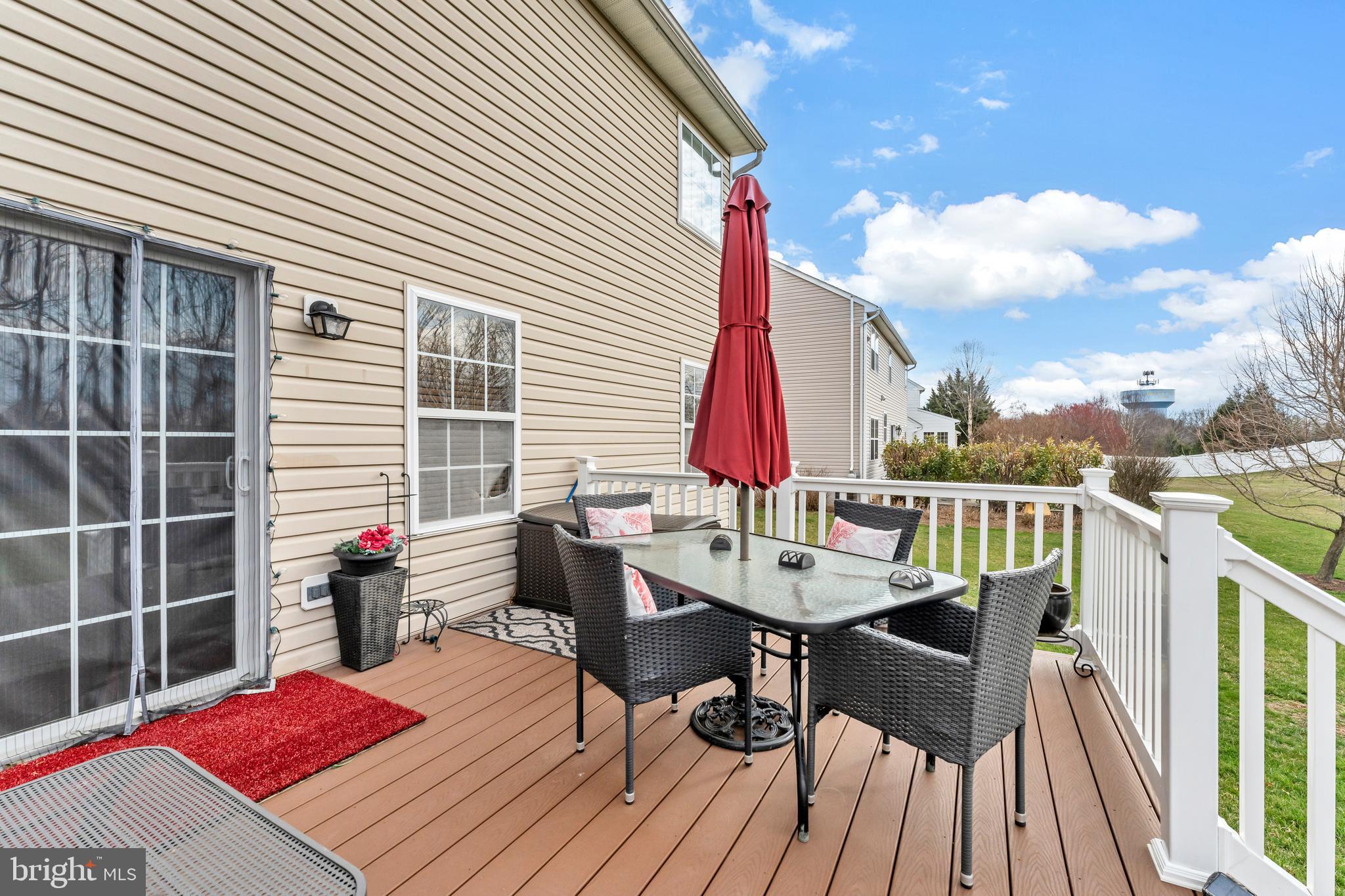 5660 Compton Lane Eldersburg, MD 21784 - Photo 38 of 44 a view of a roof deck with table and chairs