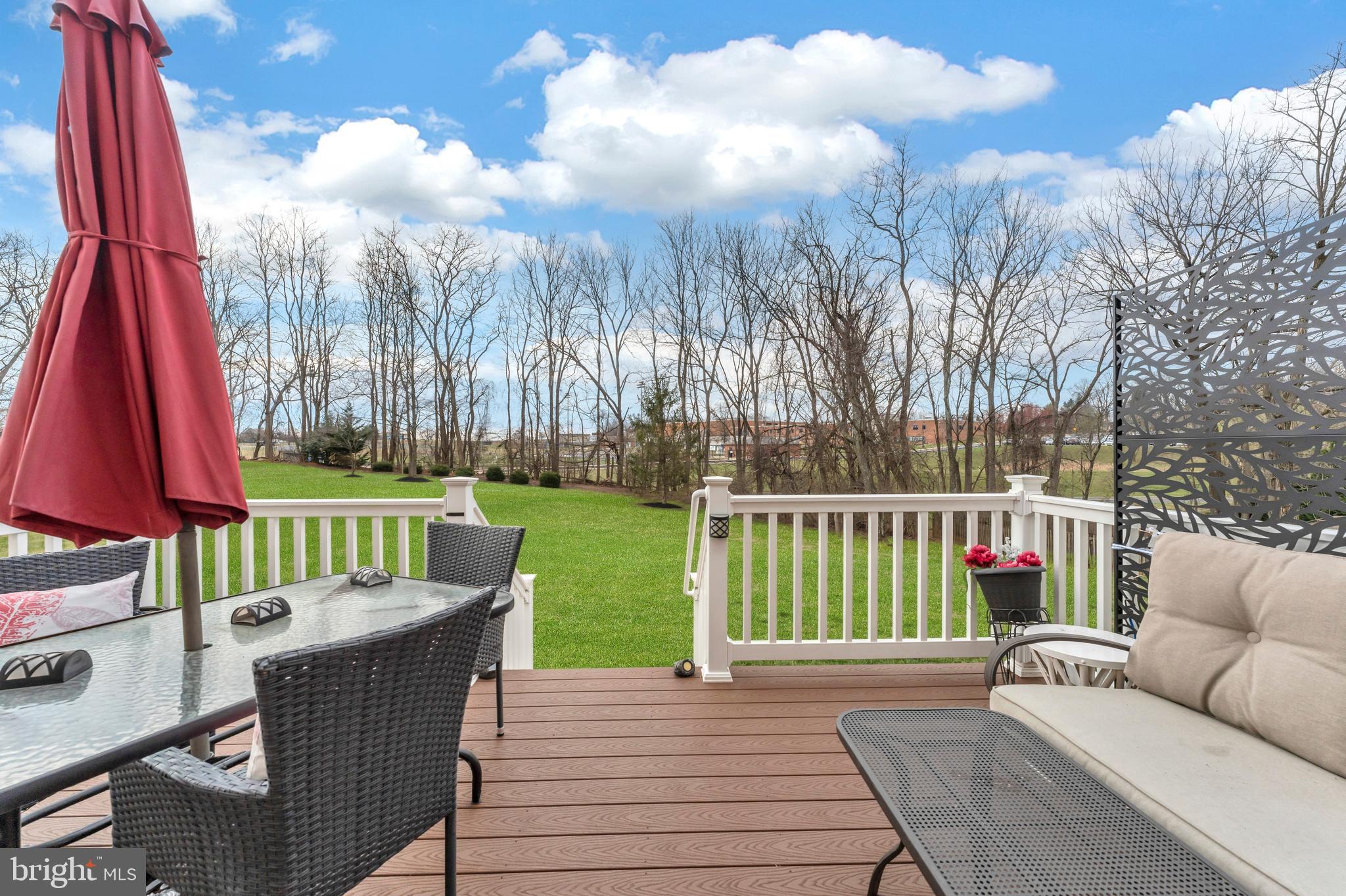 5660 Compton Lane Eldersburg, MD 21784 - Photo 39 of 44 a view of a deck with couches and wooden floor