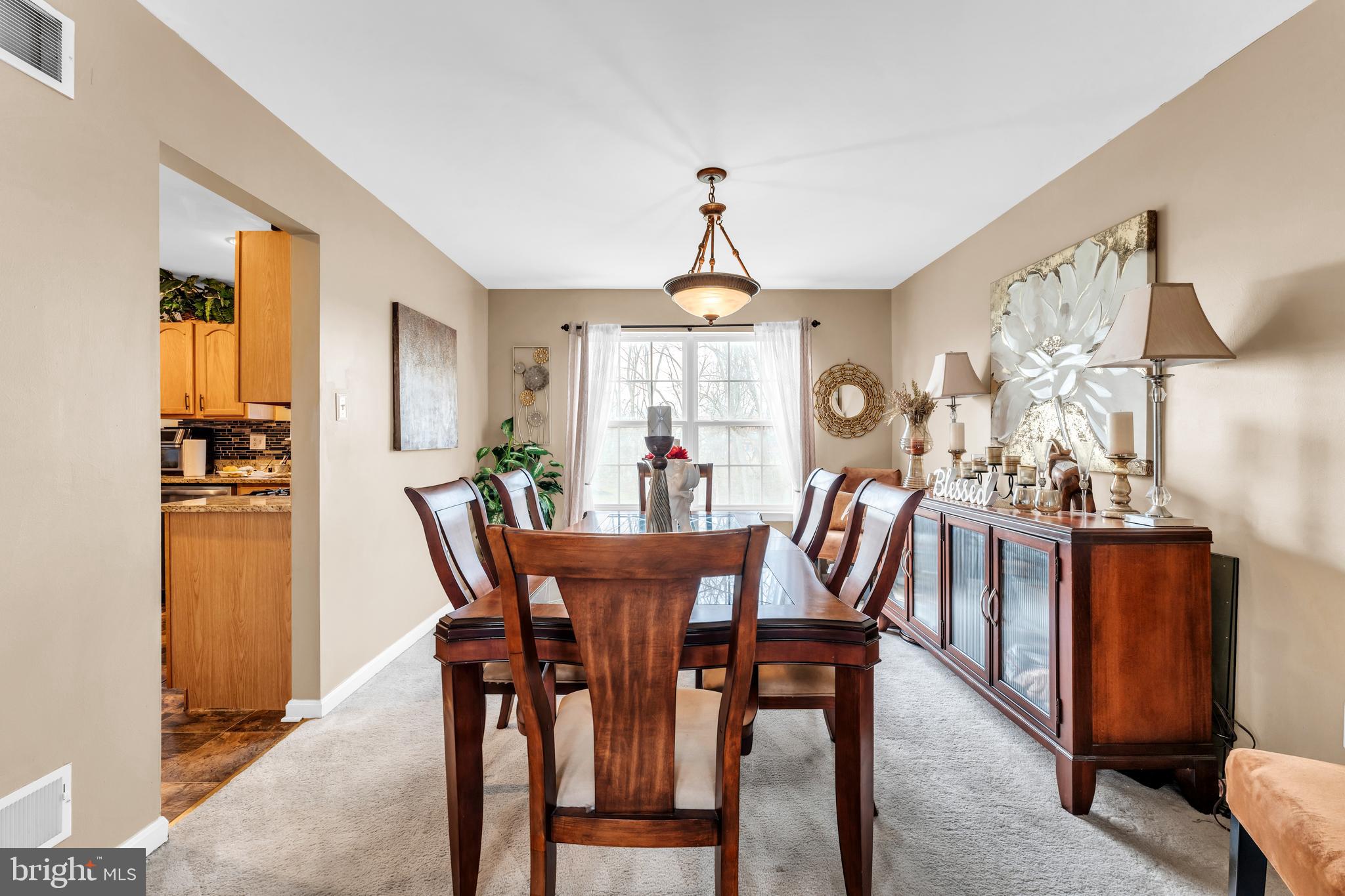 5660 Compton Lane Eldersburg, MD 21784 - Photo 9 of 44 a view of a dining room with furniture and window