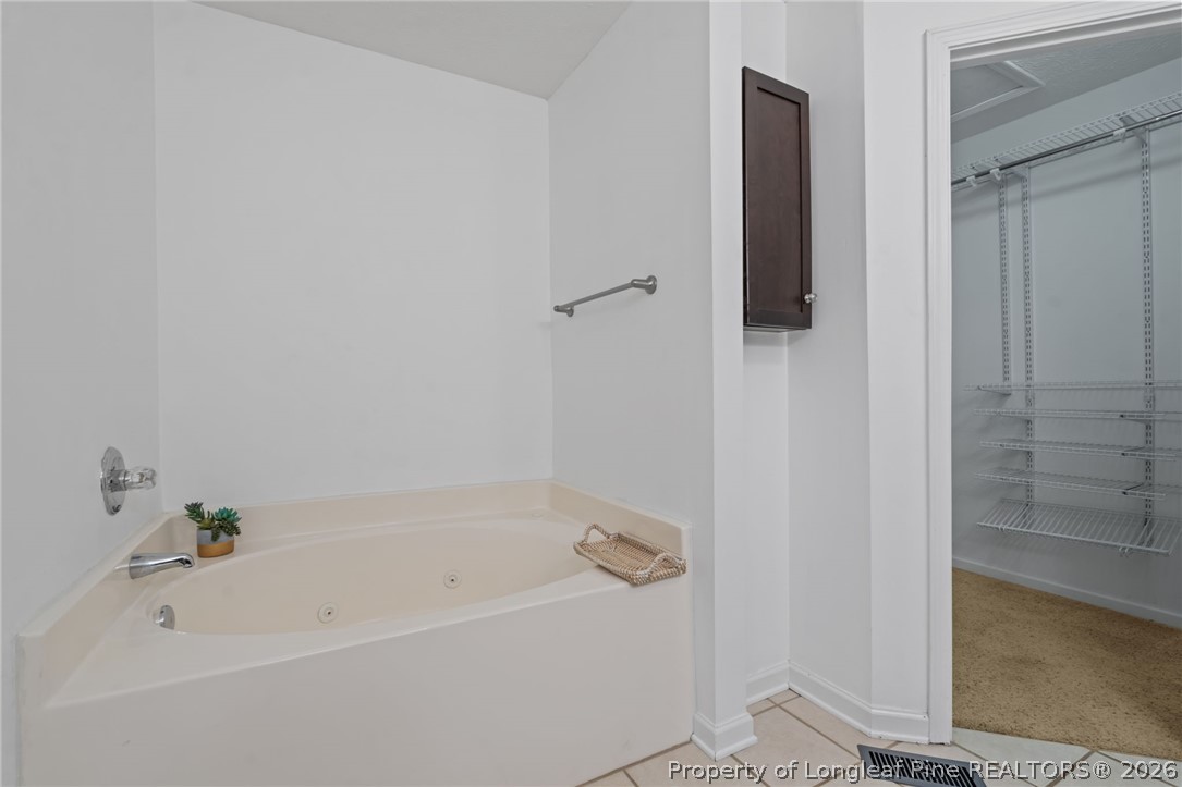 115 Shelby Street Spring Lake, NC 28390 - Photo 25 of 40 a bathroom with a bathtub