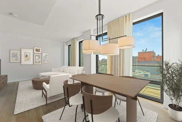 a view of a dining room with furniture and window
