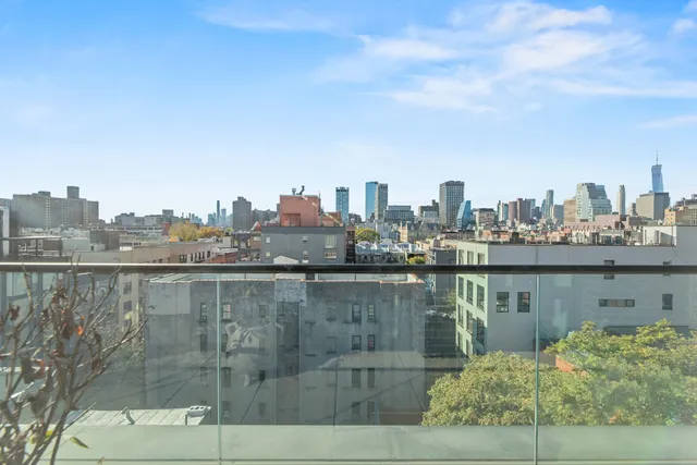 a view of a city with a lake