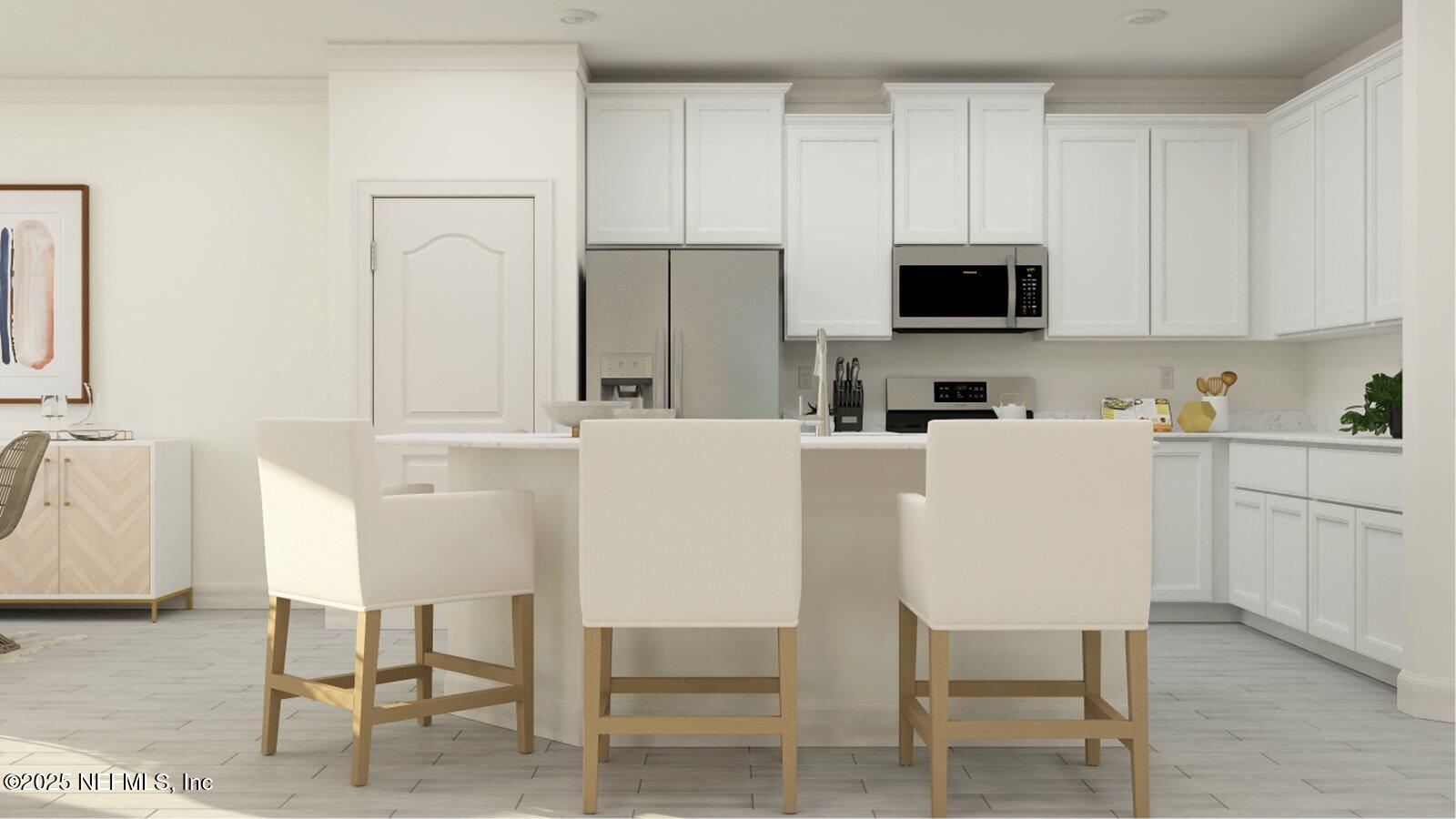 126 Hasler Avenue St. Augustine, FL 32092 - Photo 30 of 34 a kitchen with stainless steel appliances a white table and chairs in it