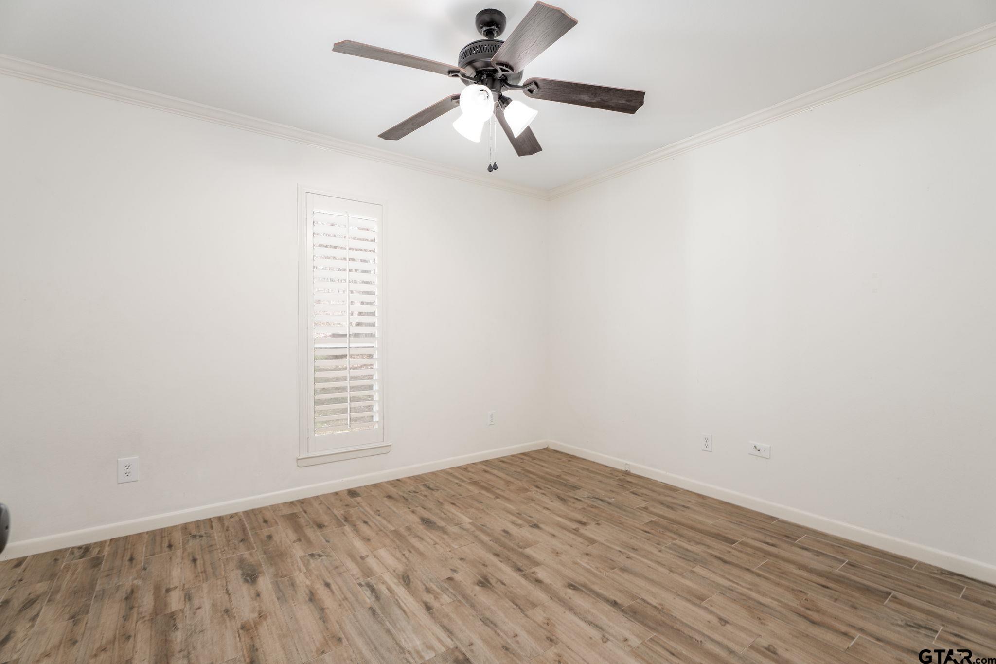 353 Deer Creek Road Big Sandy, TX 75755 - Photo 15 of 30 an empty room with a window and a ceiling fan