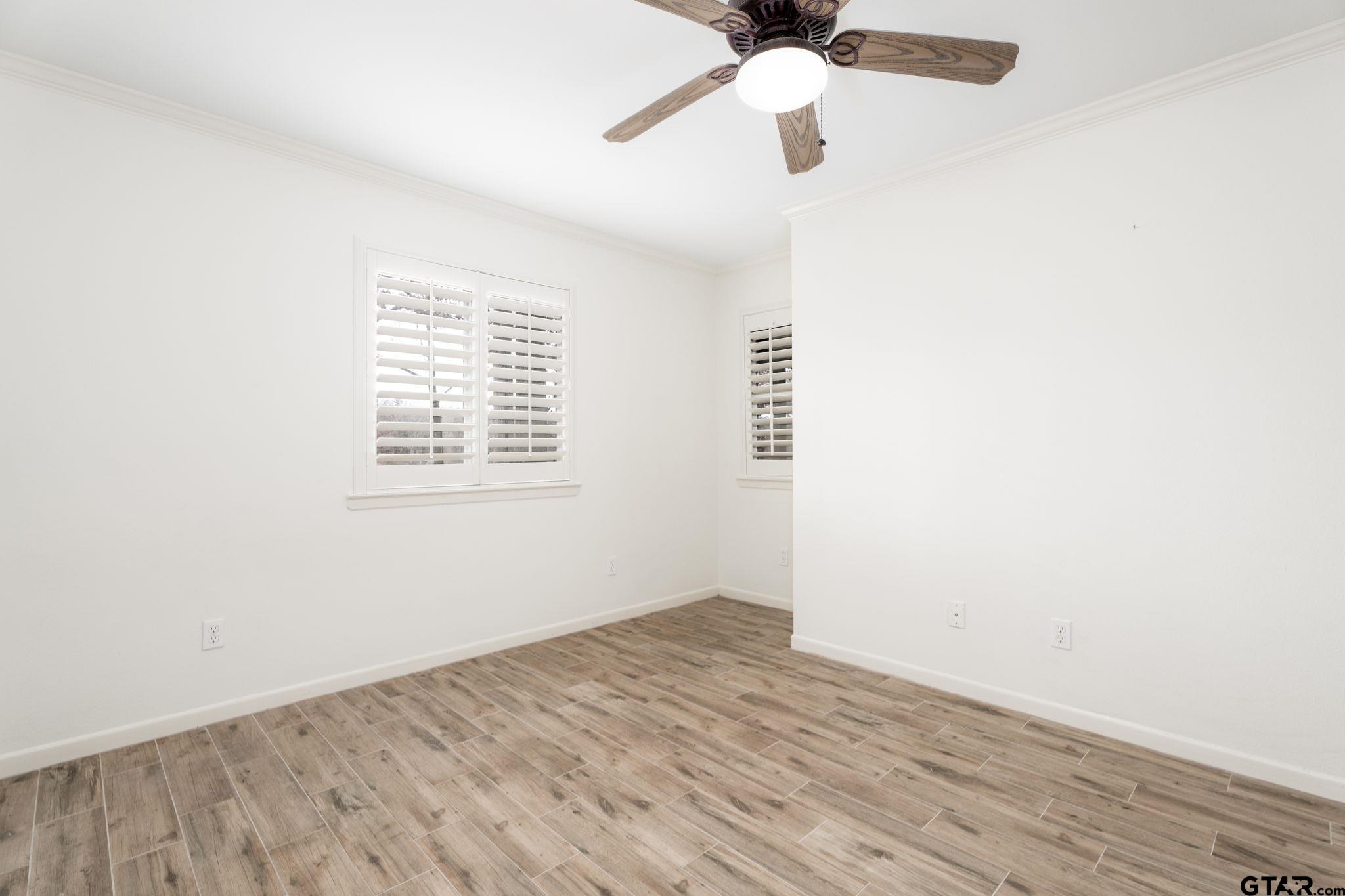 353 Deer Creek Road Big Sandy, TX 75755 - Photo 18 of 30 an empty room with a window and a ceiling fan