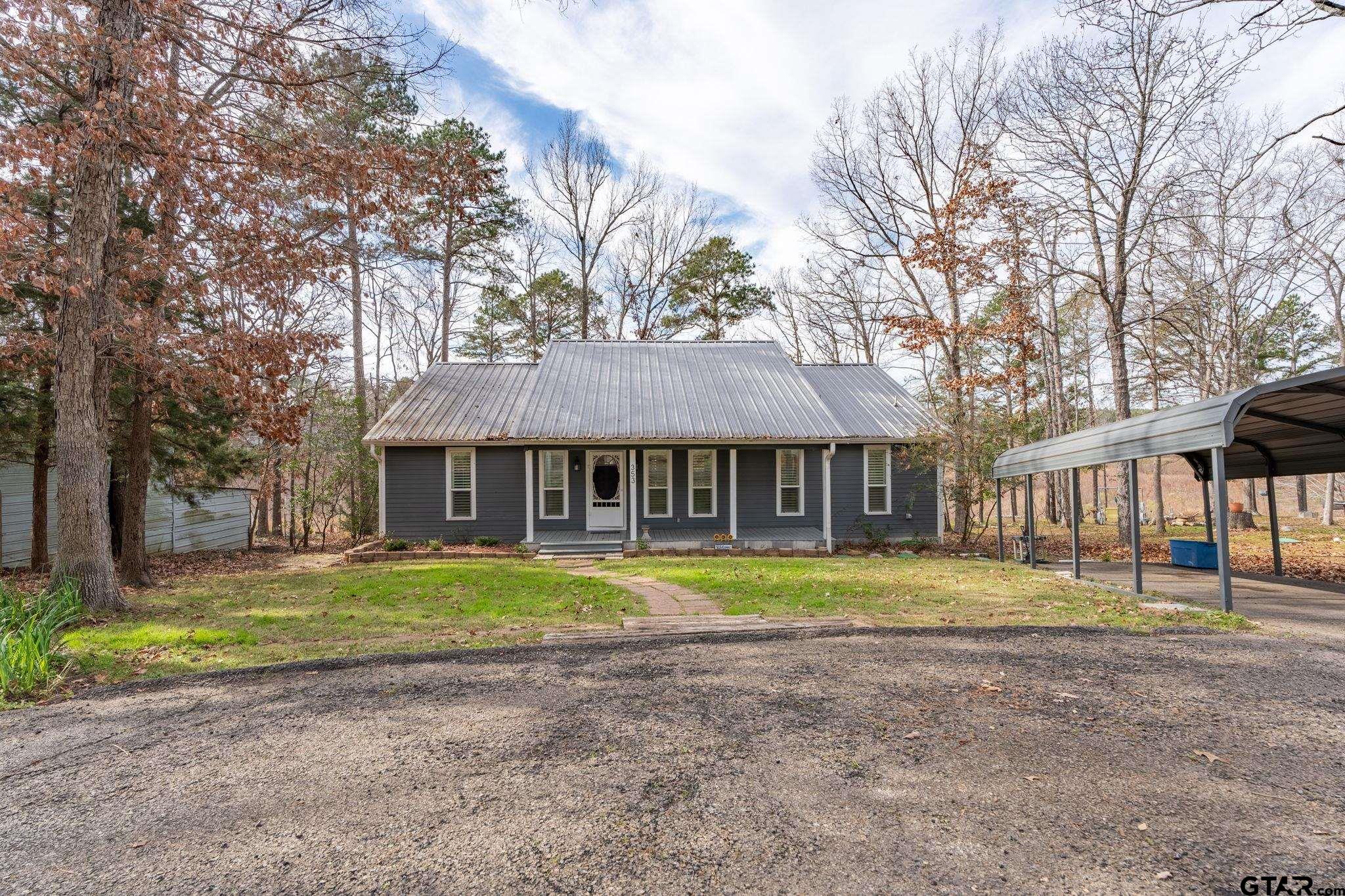 353 Deer Creek Road Big Sandy, TX 75755 - Photo 24 of 30 a front view of a house with a yard