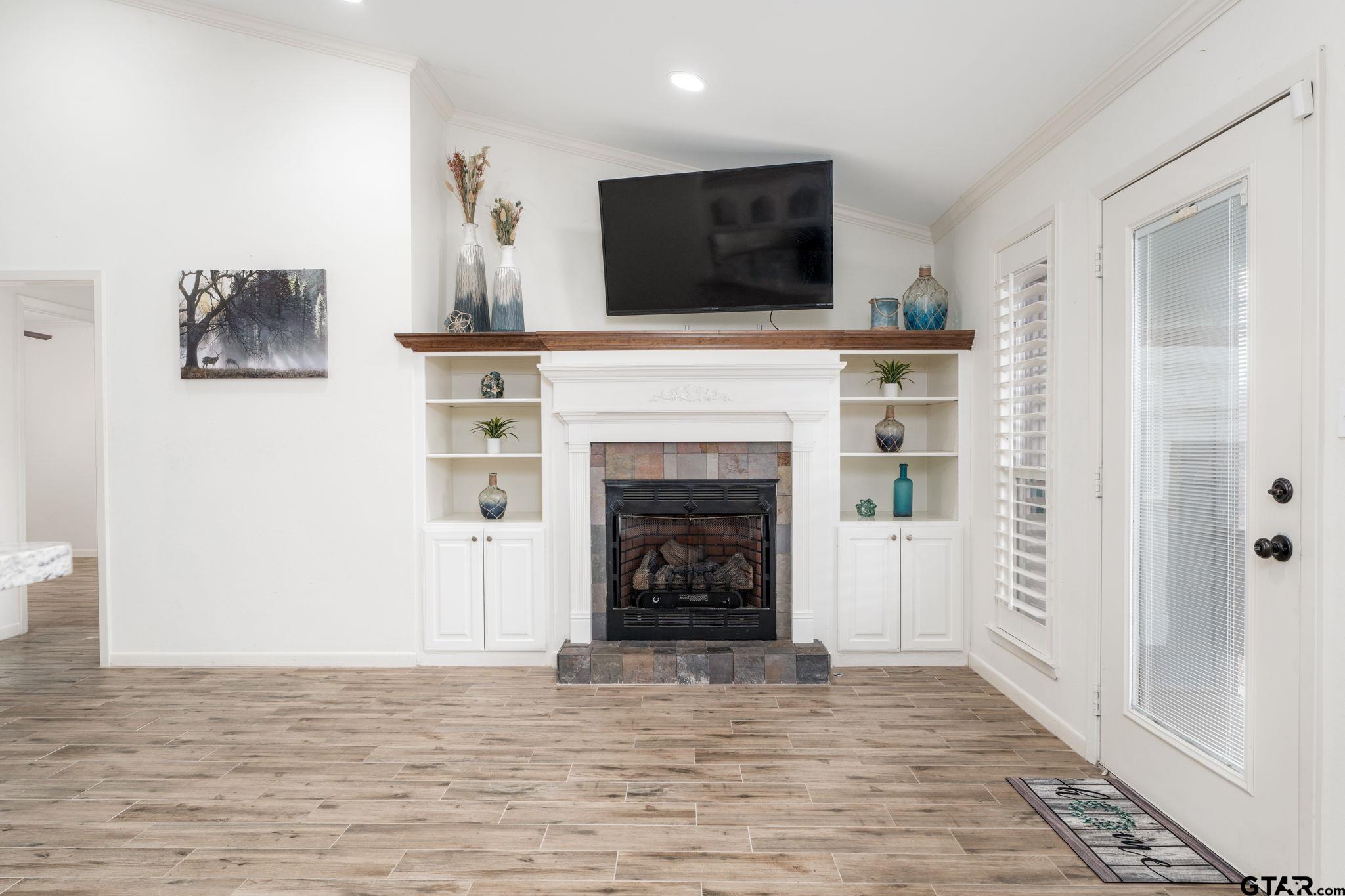 353 Deer Creek Road Big Sandy, TX 75755 - Photo 3 of 30 a living room with furniture and a fireplace