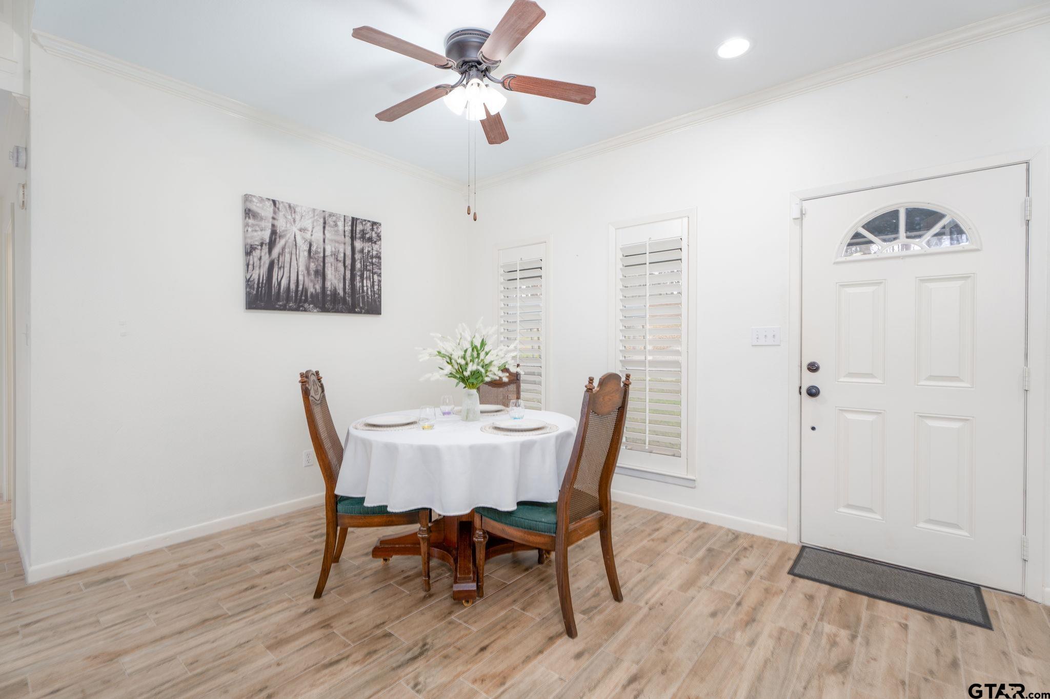 353 Deer Creek Road Big Sandy, TX 75755 - Photo 4 of 30 a view of a dining room with furniture and wooden floor
