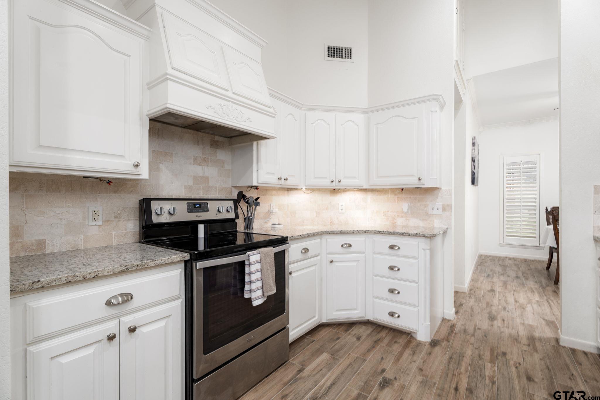 353 Deer Creek Road Big Sandy, TX 75755 - Photo 9 of 30 a kitchen with stainless steel appliances granite countertop a sink and cabinets