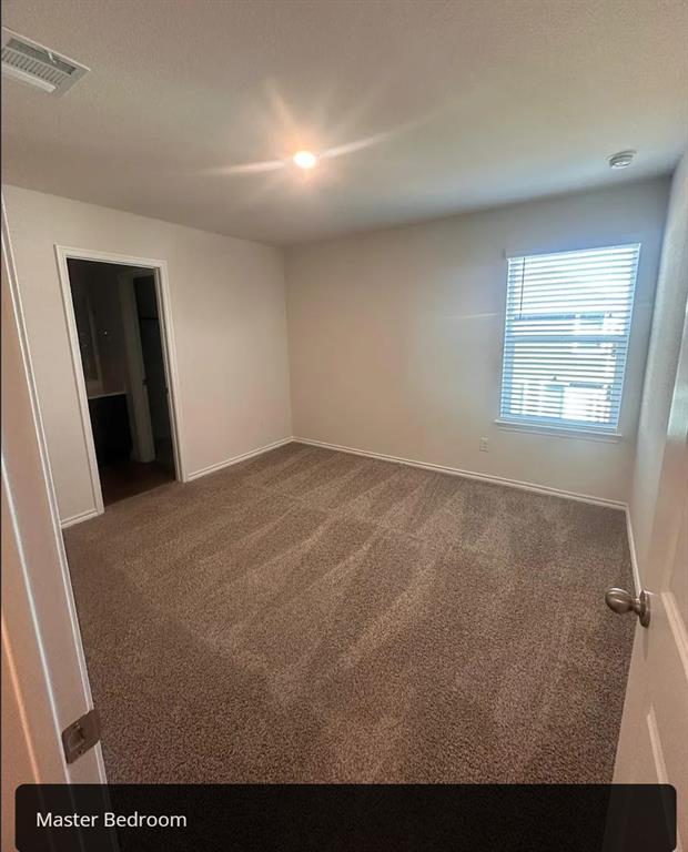 6015 Pinion Trail Princeton, TX 75407 - Photo 7 of 17 an empty room with windows