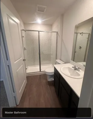 a bathroom with a sink a mirror and a shower