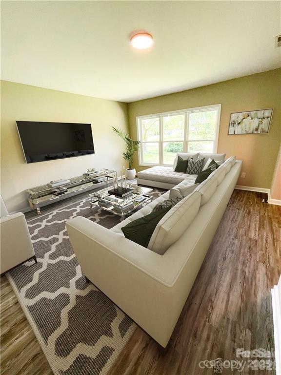 3826 Langley Road Charlotte, NC 28215 - Photo 2 of 15 a living room with couches and a flat screen tv