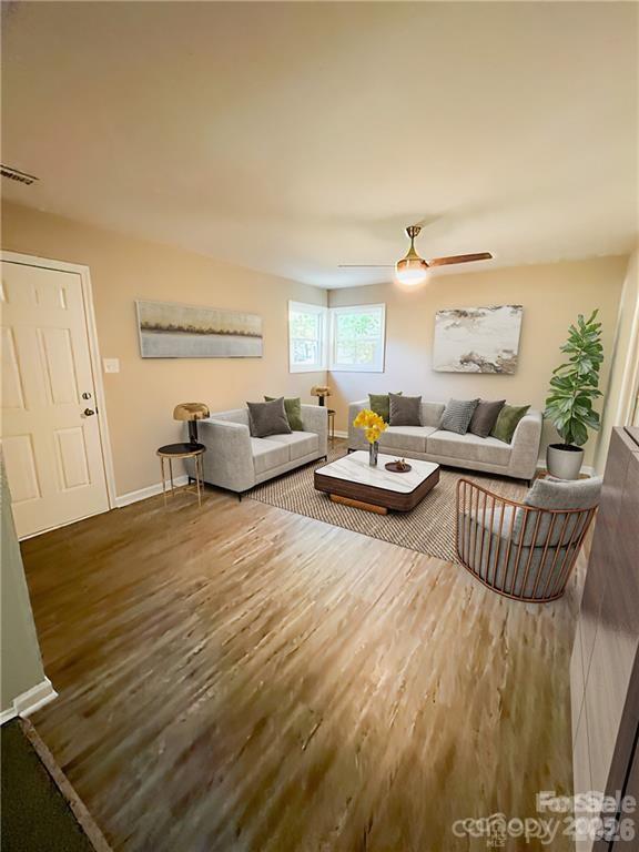 3826 Langley Road Charlotte, NC 28215 - Photo 3 of 15 a living room with furniture and a table