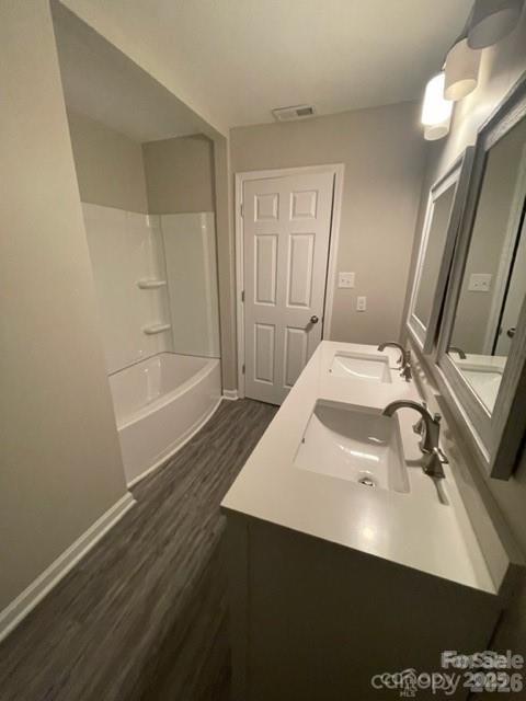 3826 Langley Road Charlotte, NC 28215 - Photo 10 of 15 a bathroom with a sink and a mirror