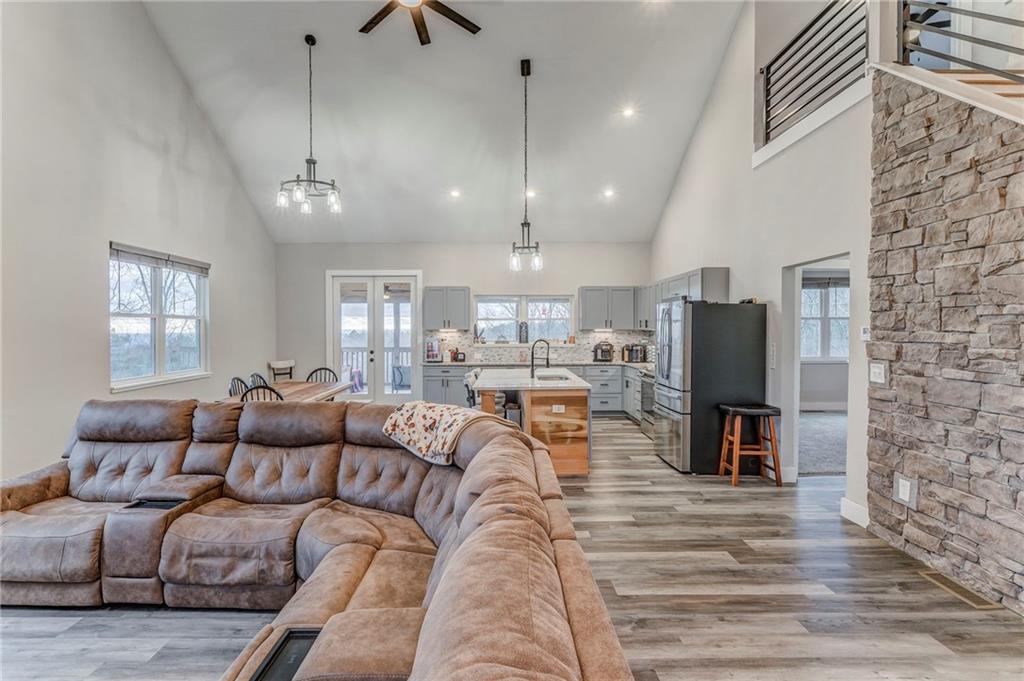 1172 Hunter Drive Ranger, GA 30734 - Photo 15 of 71 a living room with furniture kitchen view and a chandelier