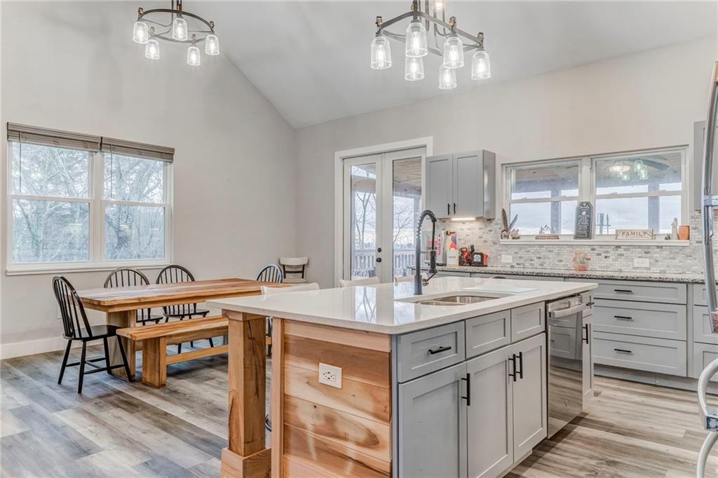 1172 Hunter Drive Ranger, GA 30734 - Photo 24 of 71 a spacious bathroom with a granite countertop sink a large mirror and a