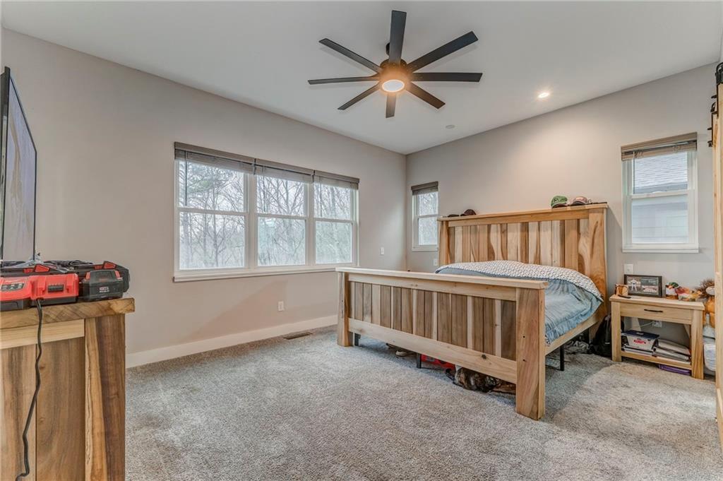 1172 Hunter Drive Ranger, GA 30734 - Photo 33 of 71 a bedroom with a bed and a window