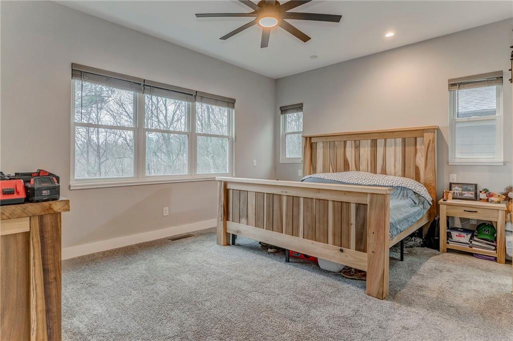 1172 Hunter Drive Ranger, GA 30734 - Photo 37 of 71 a bedroom with a bed and a window