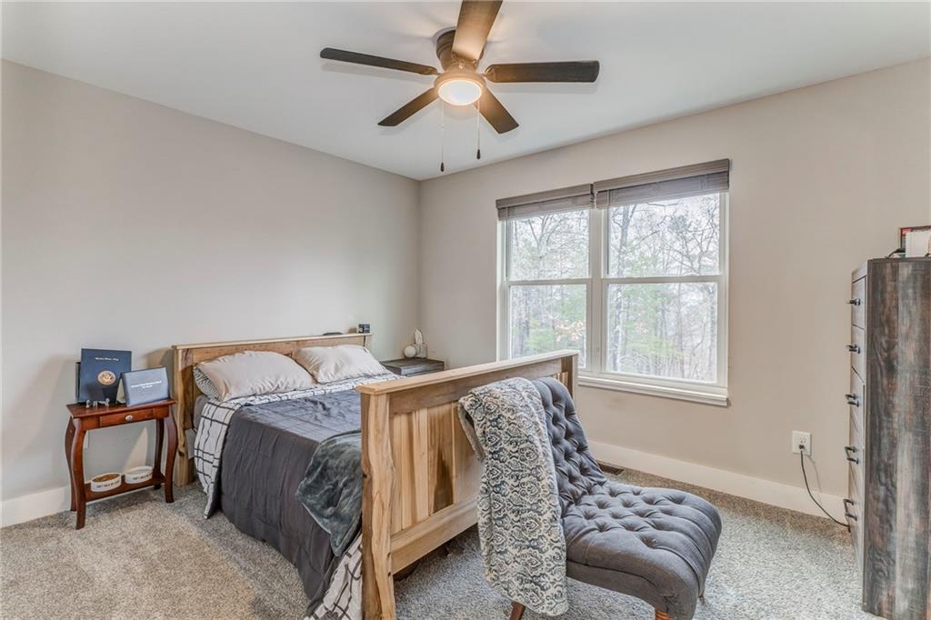1172 Hunter Drive Ranger, GA 30734 - Photo 42 of 71 a bed sitting in a bedroom next to a window