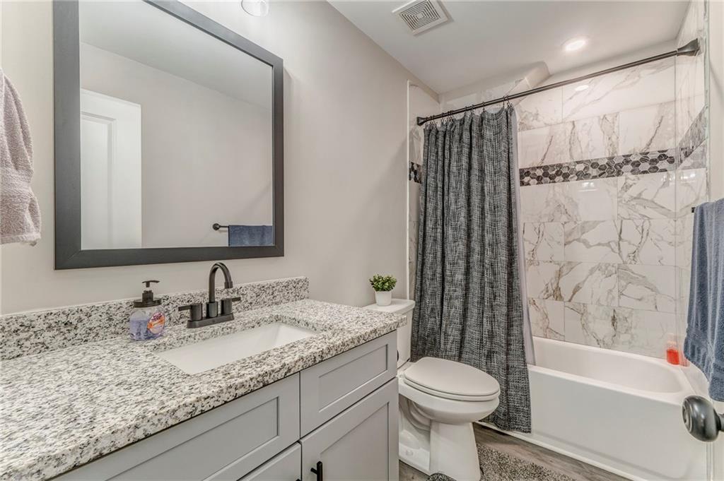 1172 Hunter Drive Ranger, GA 30734 - Photo 44 of 71 a bathroom with a granite countertop sink toilet and shower