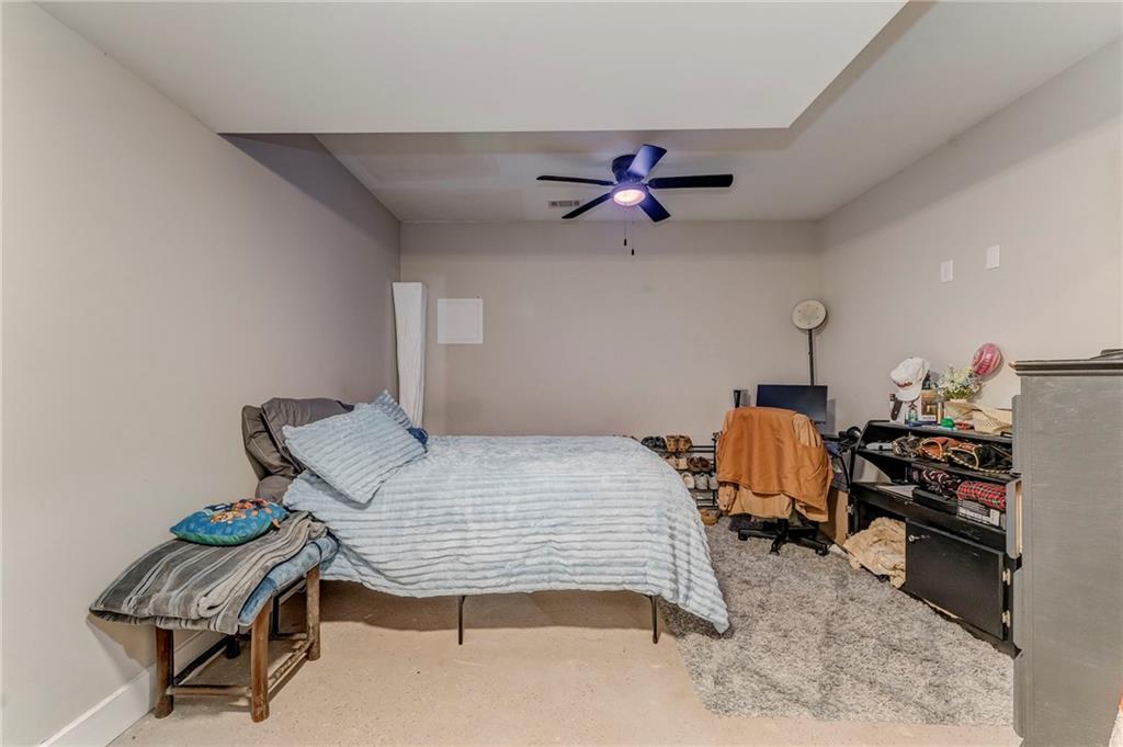 1172 Hunter Drive Ranger, GA 30734 - Photo 56 of 71 a bedroom with a bed and a chandelier