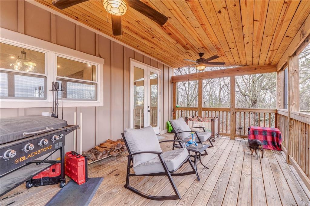 1172 Hunter Drive Ranger, GA 30734 - Photo 61 of 71 a living room with furniture and a floor to ceiling window
