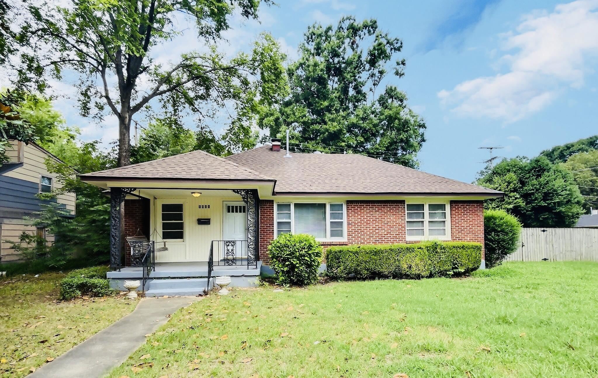 1405 South Perkins Road Memphis, TN 38117 - Photo 1 of 17 a front view of a house with a yard