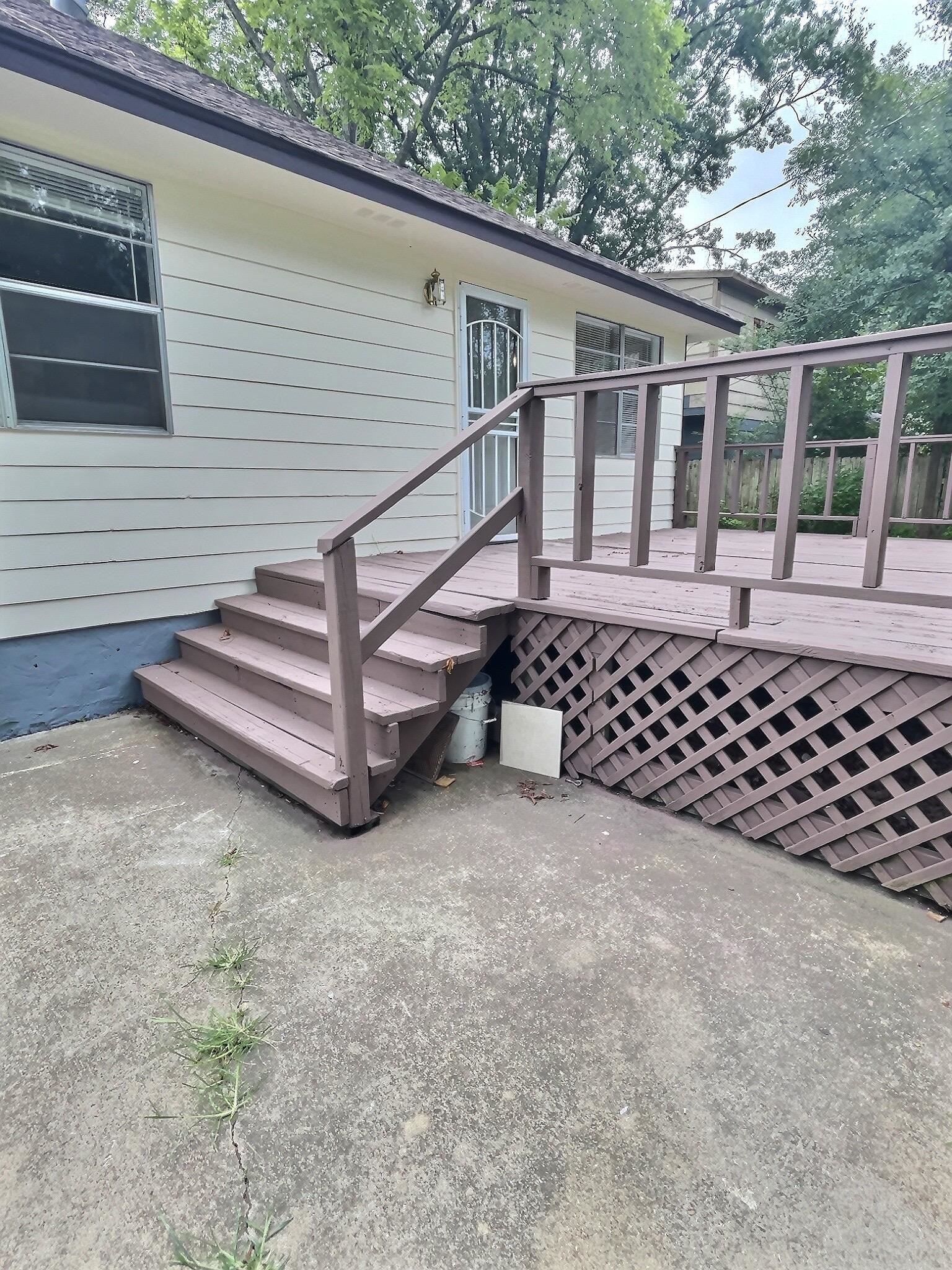 1405 South Perkins Road Memphis, TN 38117 - Photo 12 of 17 a side view of a house with a large window and wooden fence