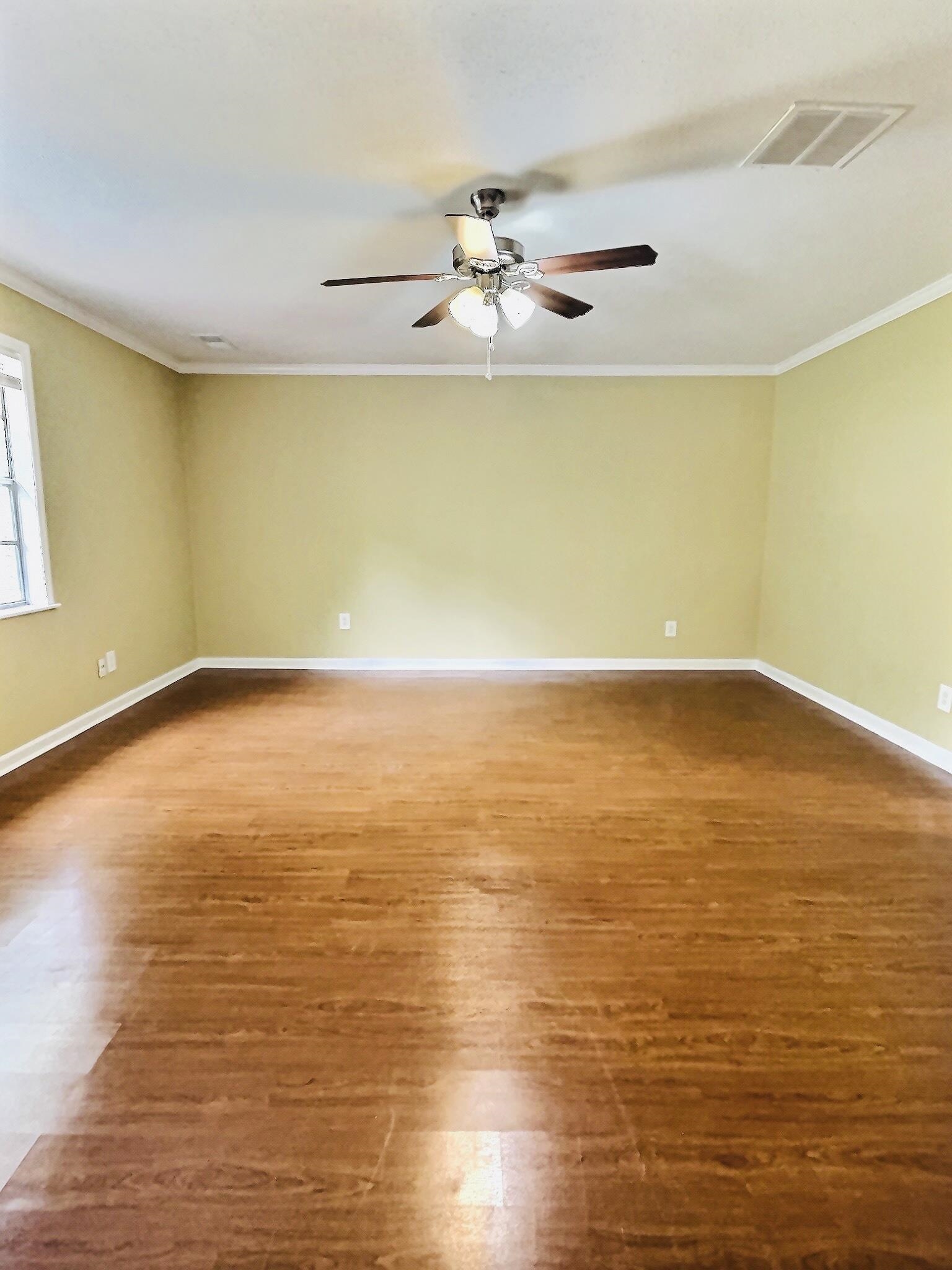 1405 South Perkins Road Memphis, TN 38117 - Photo 9 of 17 a view of a room with wooden floor and white walls