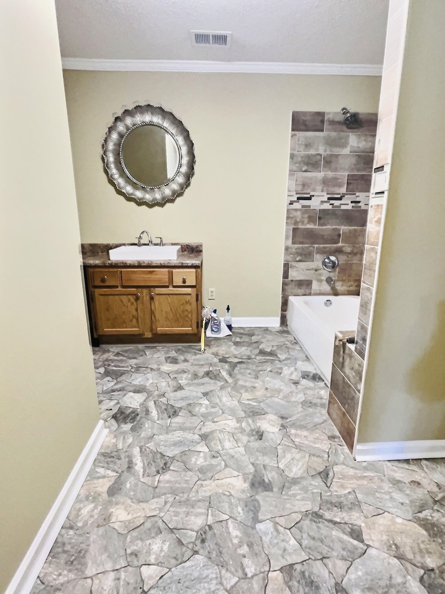 1405 South Perkins Road Memphis, TN 38117 - Photo 10 of 17 a bathroom with a granite countertop sink a mirror and bathtub