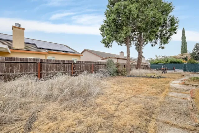 a view of swimming pool with a patio