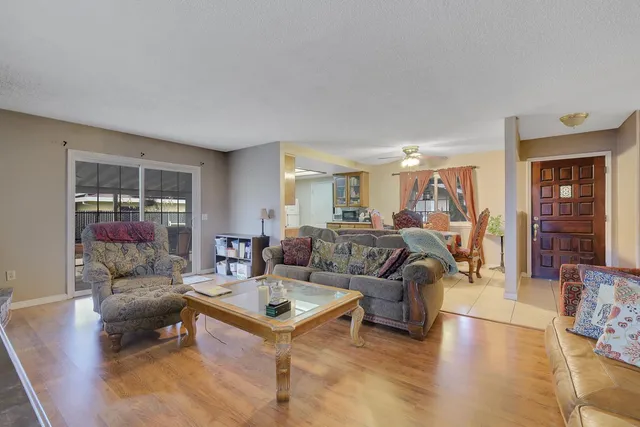 a living room with furniture and a table