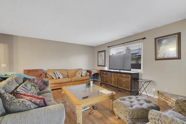 a living room with a couch and a dining table