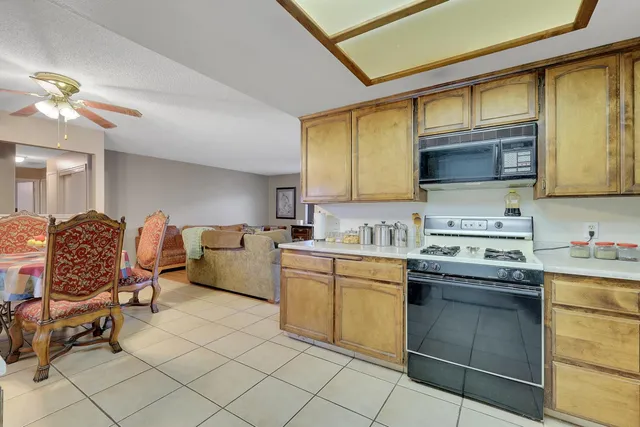 a kitchen with a stove cabinets and a sink