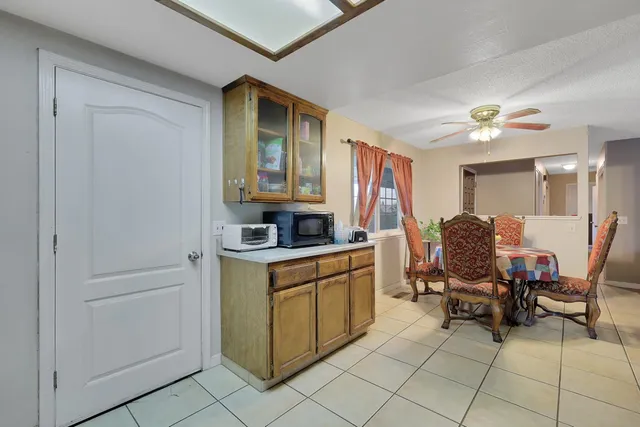 a view of kitchen with cabinets