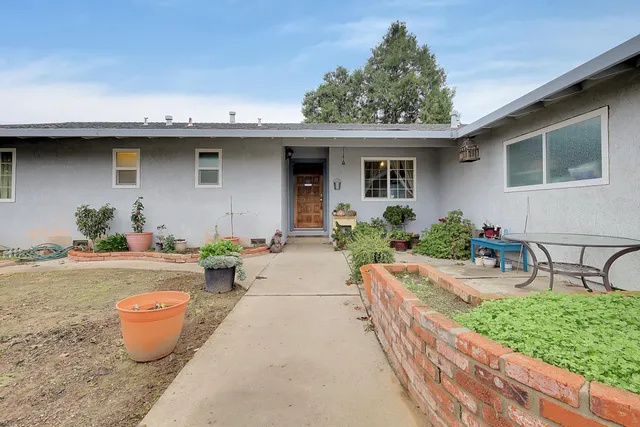 a front view of a house with patio