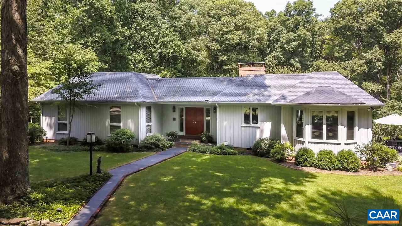 1075 Richmond Road Keswick, VA 22947 - Photo 1 of 50 a front view of a house with a yard and trees