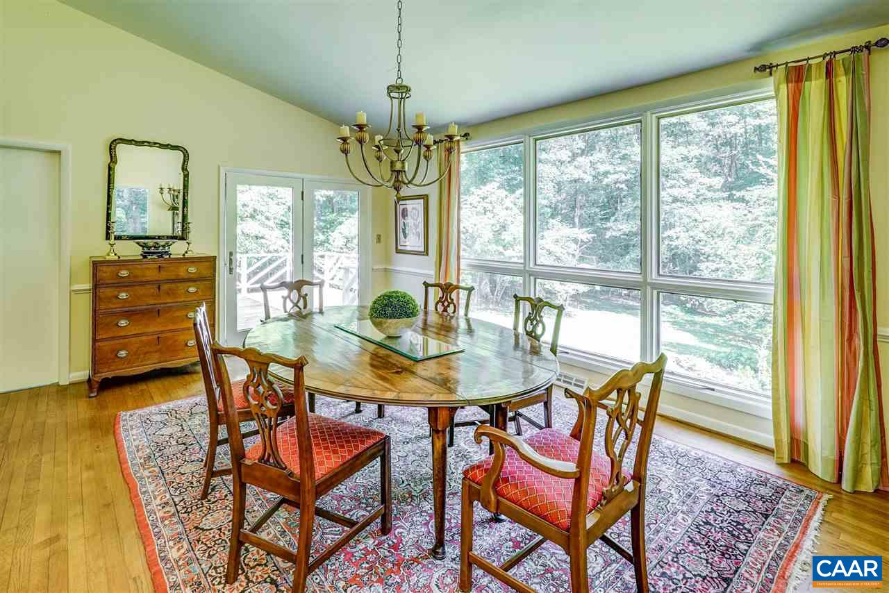 1075 Richmond Road Keswick, VA 22947 - Photo 14 of 50 a view of a dining room with furniture window and wooden floor
