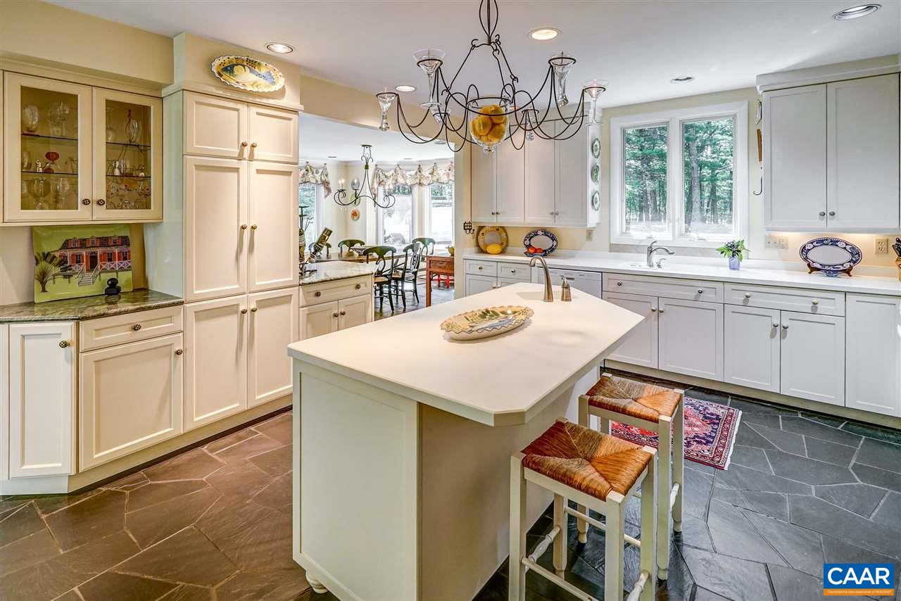 1075 Richmond Road Keswick, VA 22947 - Photo 16 of 50 a kitchen with a sink and cabinets